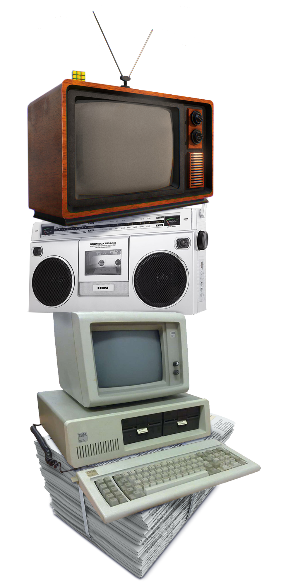 A stack of media. From bottom to top a ream of newspapers, then a computer and monitor, topped with a radio, topped with a television set